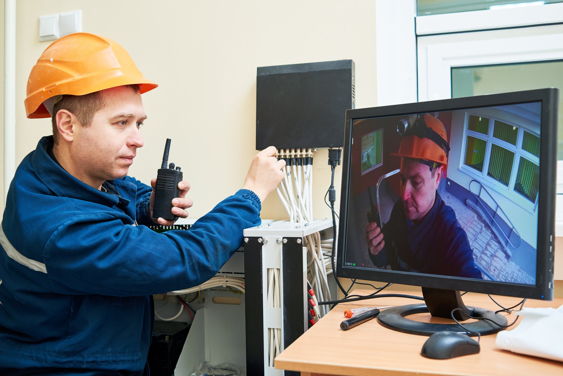 Technician Worker Adjusting Video Surveillance System